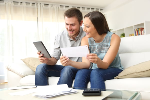 a couple checking their finances 