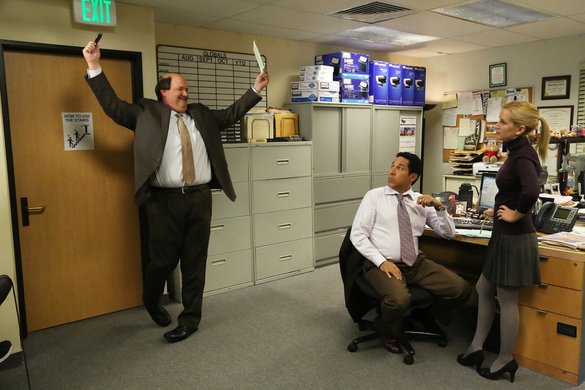 Kevin, Angela, and Oscar from The Office sitting in the accounting department